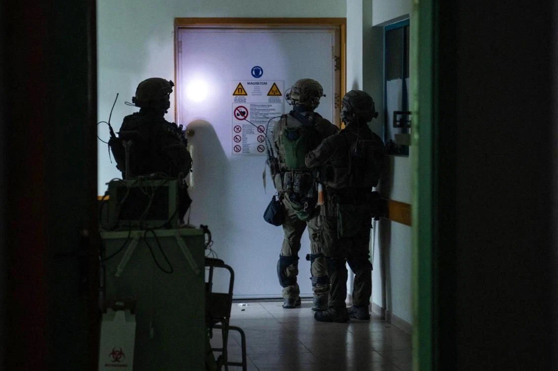 This handout picture released by the Israeli army on Nov. 15, 2023, reportedly shows Israeli soldiers carrying out operations inside Al-Shifa hospital, amid continuing battles Israel and the Palestinian militant group Hamas. (AFP)