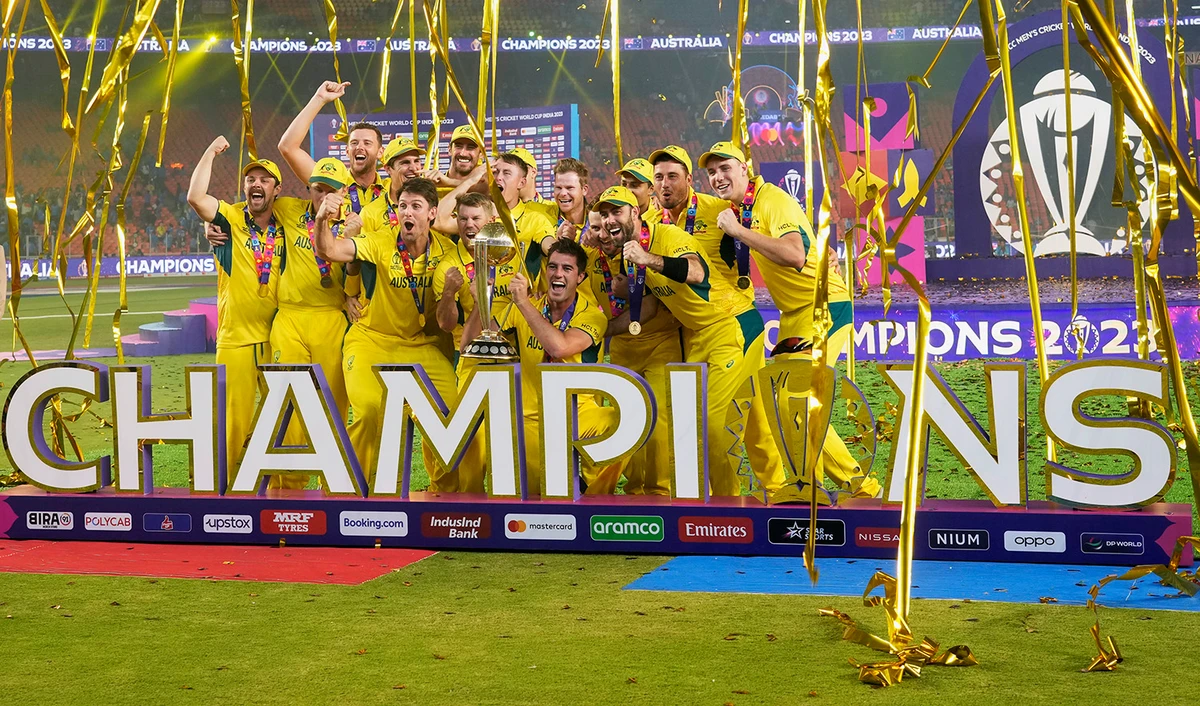 Australia players celebrate with the trophy after Australia won the ICC Men's Cricket World Cup final match against India in Ahmedabad, India, on November 19, 2023. (AP)
