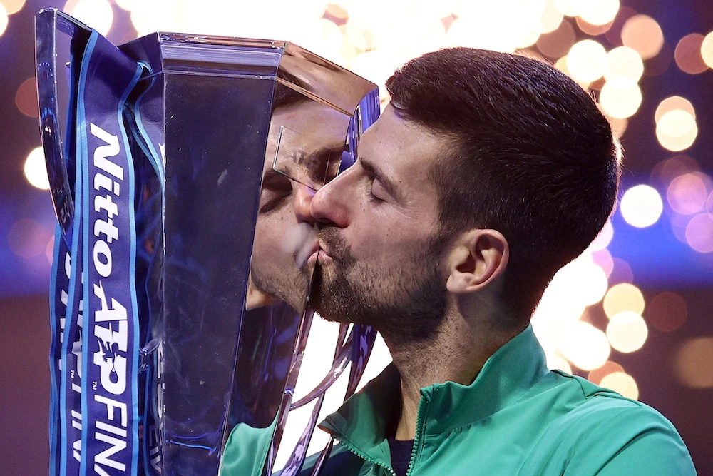 Serbia’s Novak Djokovic celebrates following Sunday’s record-breaking seventh ATP Finals victory, this time against Italy’s Jannik Sinner. (Reuters)