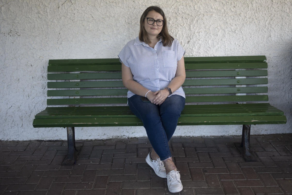 Tatyana Prima, who fled Mariupol, Ukraine, poses for a portrait outside of the apartment where she lives in Ashkelon, southern Israel, on Nov. 8, 2023. (AP)