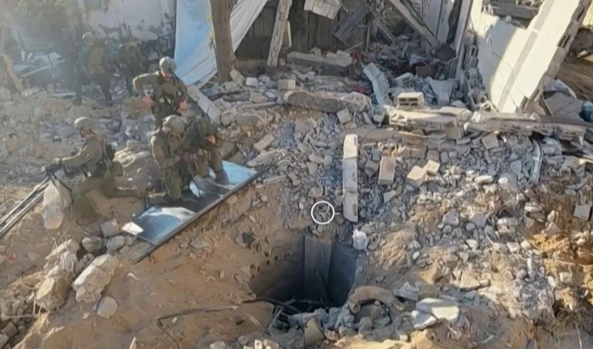 This grab from handout footage released by the Israeli army on November 17, 2023, shows what the army says is the entrance of a tunnel under Gaza’s Al-Shifa hospital that stretches beneath the complex where troops have been conducting a major operation. (AFP)