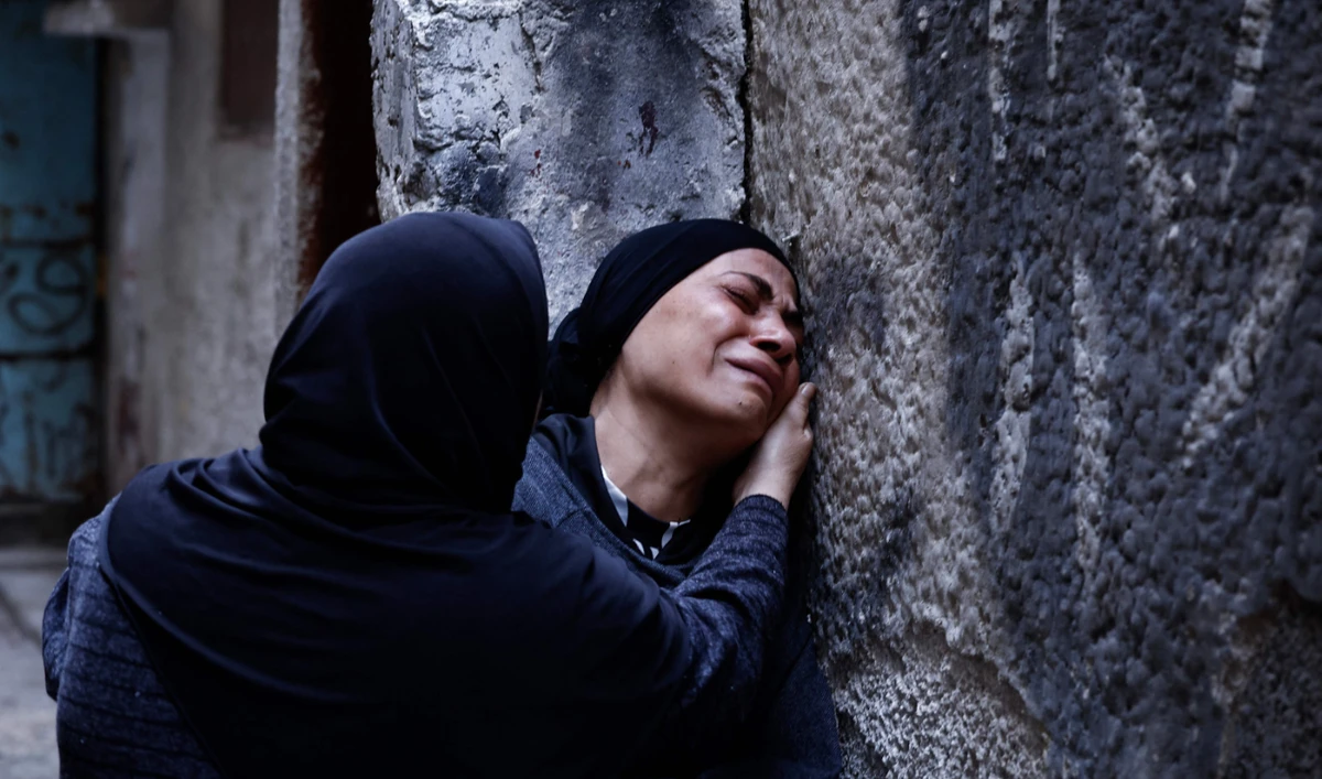 Relatives cry during the funeral of Palestinian Hussein Abu Jaasa, 52, who was killed during an Israeli raid in the Balata refugee camp, in Nablus, occupied West Bank, on Wednesday. (AFP)