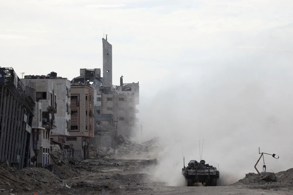 An Israeli tank operates, amid the ongoing ground operation of the Israeli army against Hamas, in the northern Gaza Strip. (Reuters)