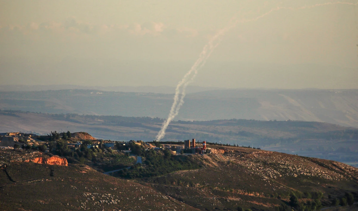 A picture taken from southern Lebanon near the eastern border with Israel shows rockets being fired by the Hezbollah group towards Israel on November 21, 2023. (AFP/File)