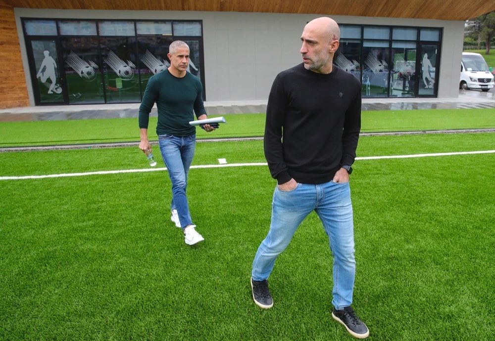 Albania's head coach Sylvinho, background, and his assistant Argentinian Pablo Zabaleta attend an interview with the Associated Press in Tirana, Albania, Wednesday. Taking it into the Euro 2024 finals was a dream come true for Albania's Latin coaches. (AP)