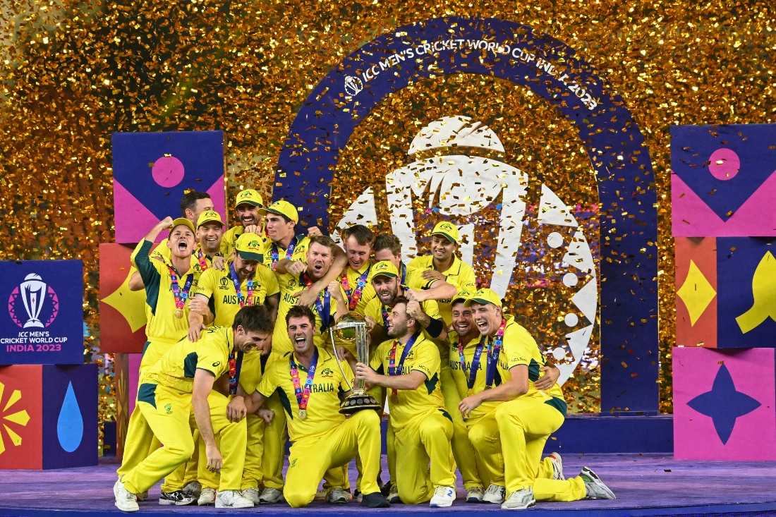 Australia's players celebrate with the trophy after winning the 2023 ICC Men's Cricket World Cup one-day international (ODI) final match against India at the Narendra Modi Stadium in Ahmedabad. (AFP)