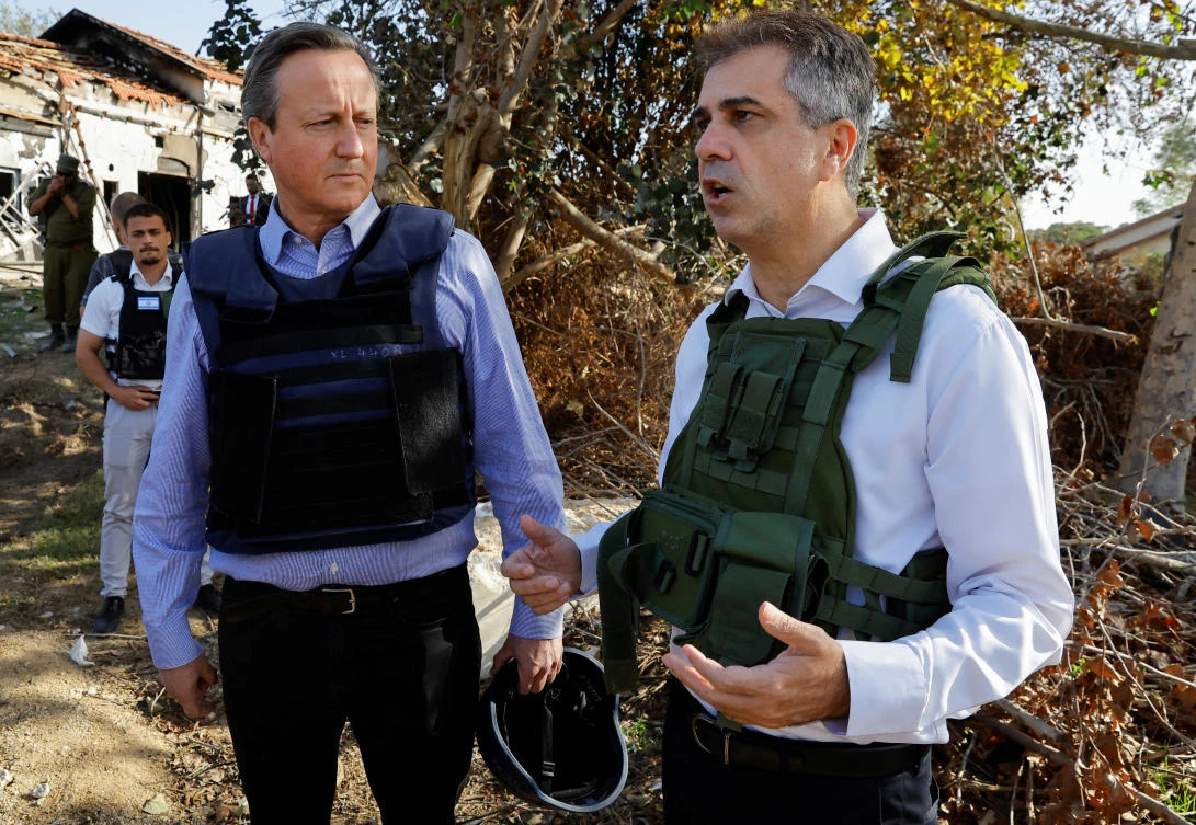 British Foreign Secretary David Cameron and Israeli Foreign Minister Eli Cohen visit Kibbutz Beeri following the Oct. 7 deadly attack by Hamas, in southern Israel, on Nov. 23, 2023. (Reuters)