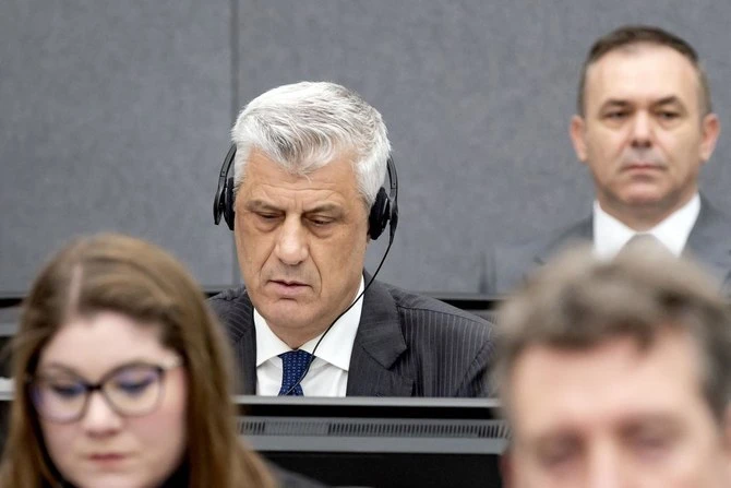 Former Kosovo president Hashim Thaci and former KLA figure Rexhep Selimi sit in court as they appear on charges of war crimes before the Kosovo Tribunal in The Hague on Apr. 3, 2023. (AFP/File)