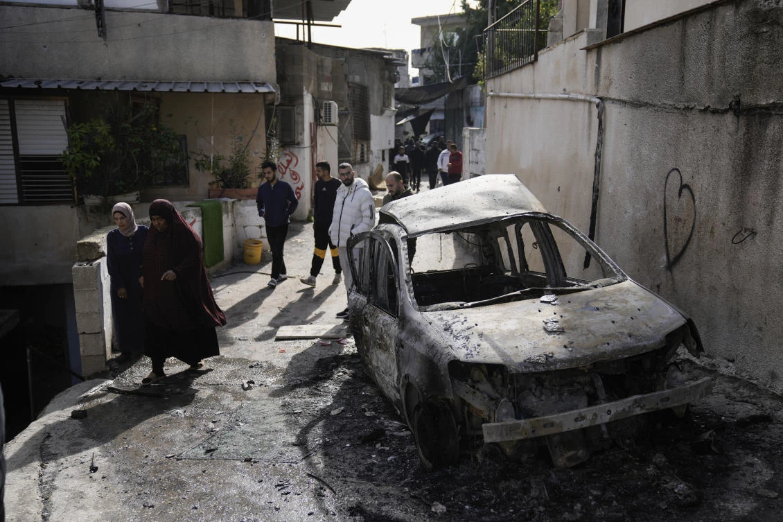 Palestinians inspect the site of an Israeli strike after a military raid in the town of Tulkarem, West Bank, on Nov. 22, 2023. (AP)