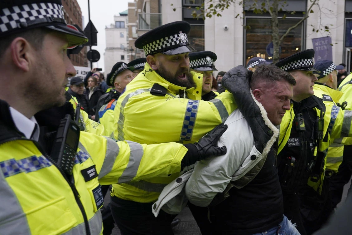 Far-right activist Stephen Yaxley-Lennon known as Tommy Robinson is arrested by police during an anti-Semitism demonstration in London, Sunday, Nov. 26, 2023. (AP)