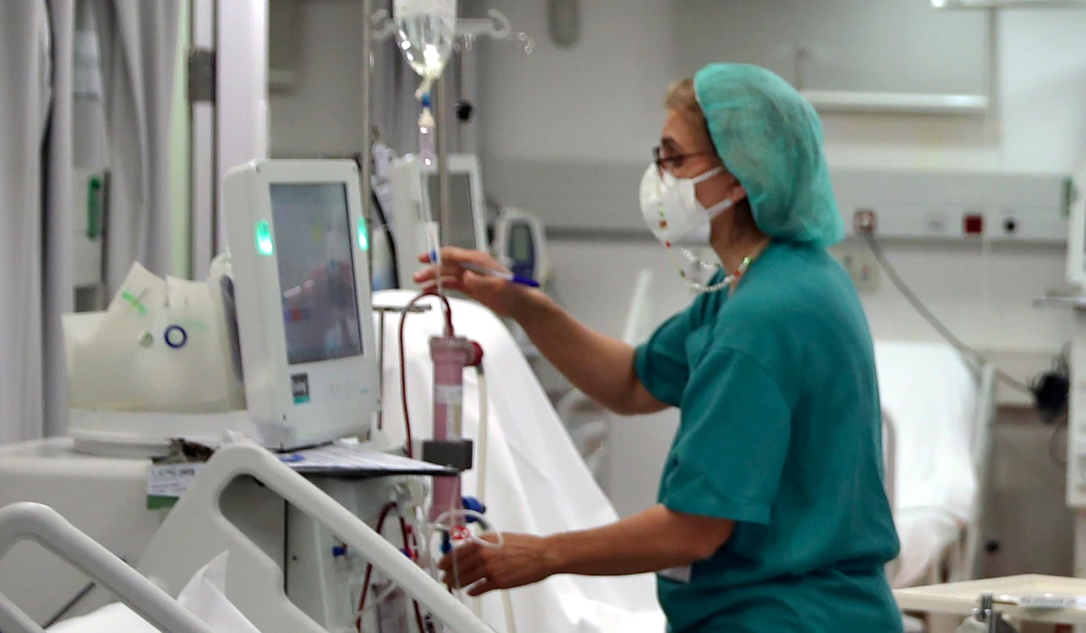 A nurse checks a patient undergoes dialysis. (AP)