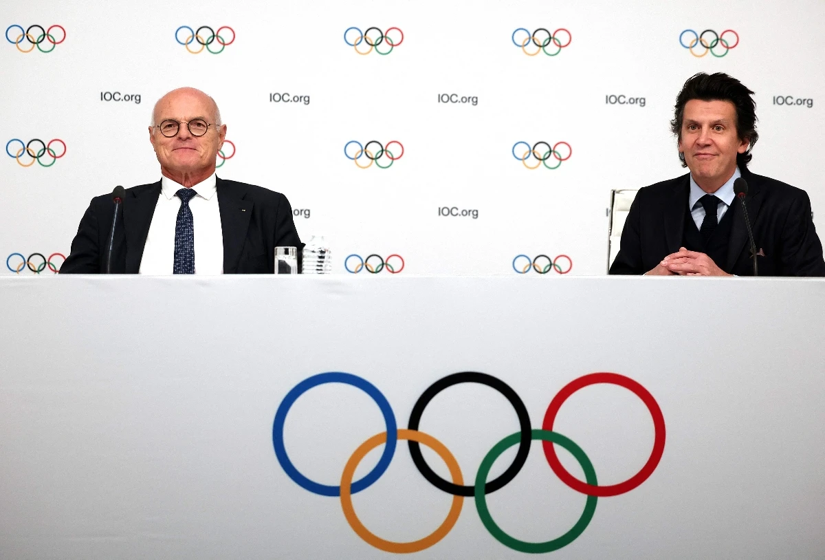 IOC member and Advisory Board member Karl Stoss of Austria (L) and Olympic Games Executive Director Christophe Dubi during a press conference following the IOC Executive Board committee meeting in Paris on Nov. 29, 2023. (AFP)
