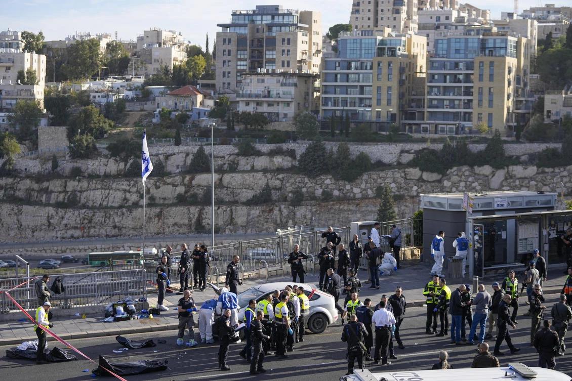 Israeli police said gunmen opened fire Thursday on people waiting for buses and rides where a main highway enters Jerusalem from Tel Aviv. (AP)