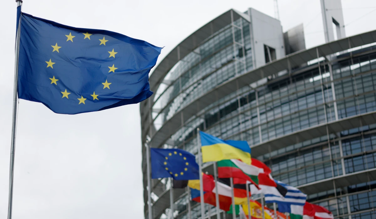 The European flag, left, flies at the European Parliament in Strasbourg, eastern France, on April 18, 2023. (AP)
