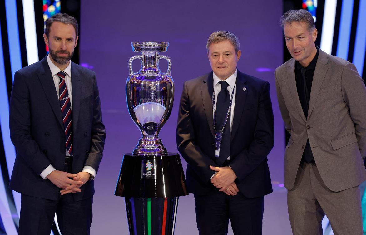 England’s football manager Gareth Southgate, Serbia’s head coach Dragan Stojkovic and Denmark’s head coach Kasper Hjulmand of Group C pose next to the trophy after the final draw for the UEFA Euro 2024 European Championship football competition in Hamburg on Dec. 2, 2023. (AFP)