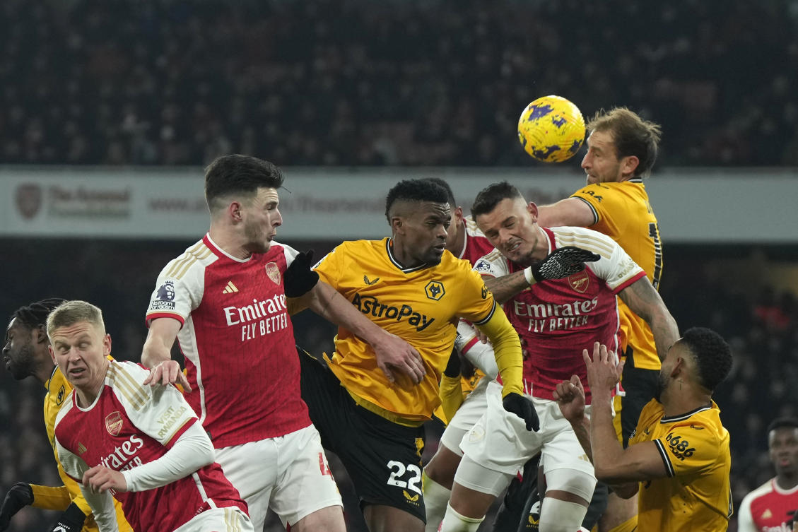 Wolverhampton Wanderers’ Craig Dawson heads the ball during their English Premier League match against Arsenal at the Emirates Stadium, in London on Dec. 2, 2023. (AP)