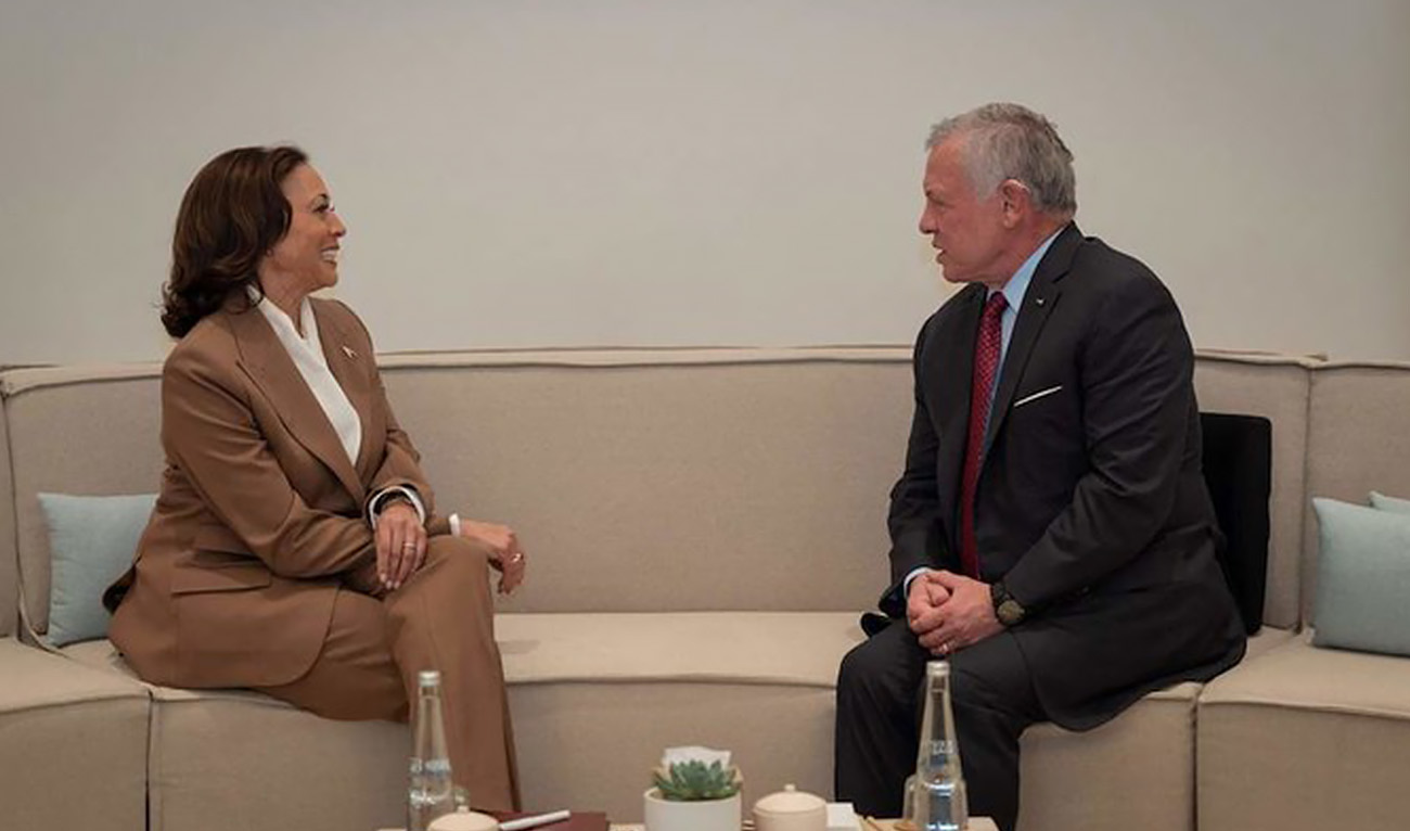 A handout picture released by the Jordanian Royal Palace shows King Abdullah II meeting US Vice President Kamala Harris on the sidelines of the COP28 climate summit in Dubai, on Dec. 2, 2023. (AFP/Jordanian Royal Hashemite Court)