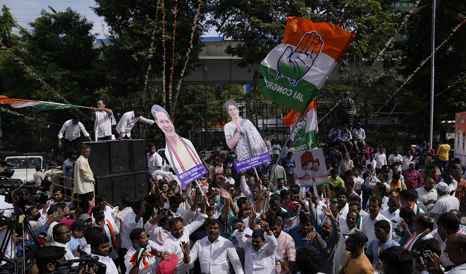 Supporters of India's main opposition party, Indian National Congress, celebrate early leads for their party in Telangana state elections in Hyderabad, India on December 3, 2023. (AP)
