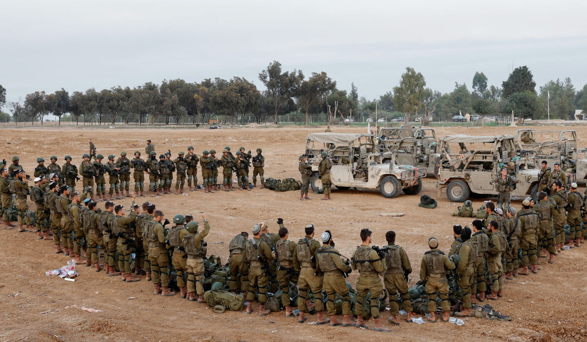 Israeli soldiers stand in order, amid the ongoing conflict between Israel and the Palestinian Islamist group Hamas, near Israel's border with Gaza, in southern Israel, December 4, 2023. (REUTERS)