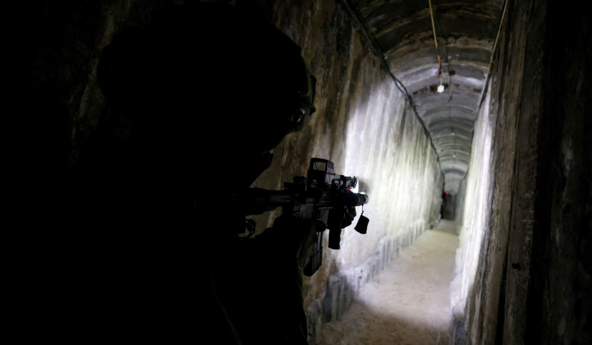 An Israeli soldier secures a tunnel underneath Al Shifa Hospital in Gaza City, amid the ongoing ground operation of the Israeli army against Palestinian Islamist group Hamas, in the northern Gaza Strip, November 22, 2023. (REUTERS)