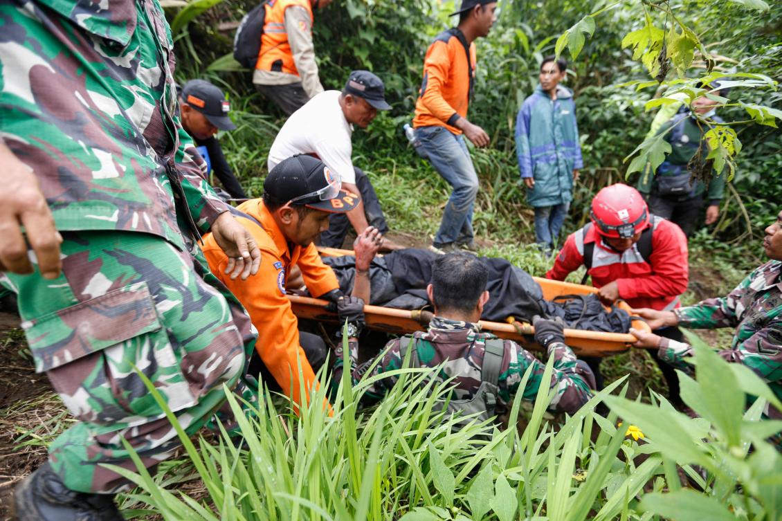 Rescuers are attempting manual evacuations, walking to the top of Mount Marapi and evacuating the victims on stretchers because of ongoing eruptions and poor visibility. (AFP)