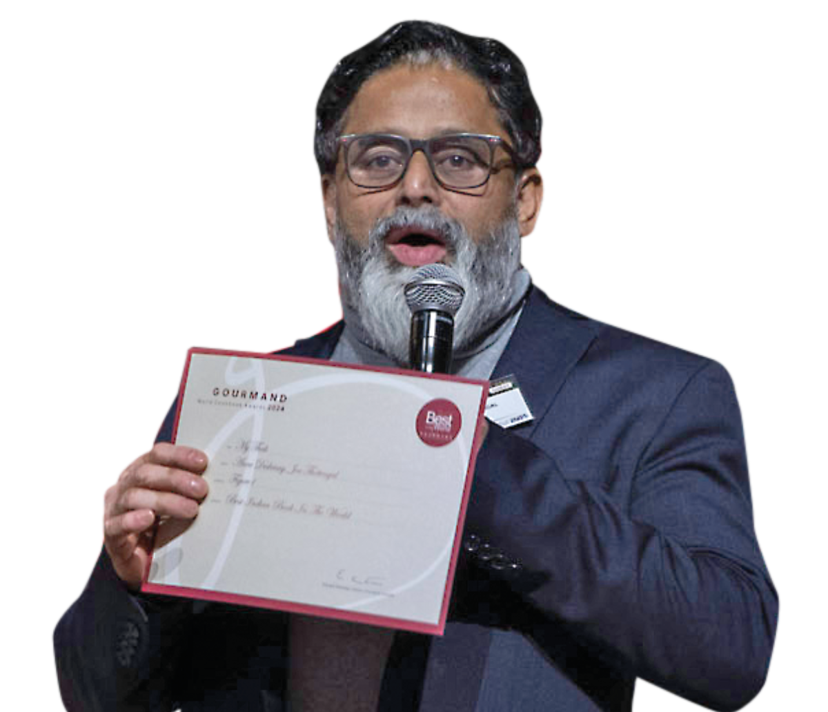Canadian Chef Joe Thottungal accepts the Gourmand Award at the Saudi Feast Food Festival in Riyadh.