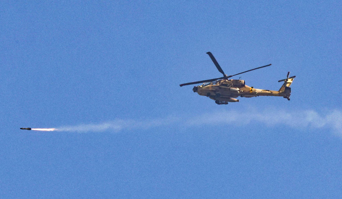 A picture taken from southern Israel near the border with the Gaza Strip on December 6, 2023, shows a Black Hawk military transport helicopter flying near the border with the Palestinian territory amid continuing battles between Israel and the militant group Hamas. (AFP)