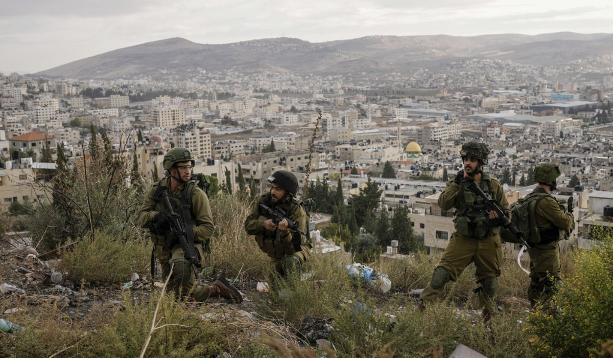 Israeli soldiers are seen during a military operation, Nov. 19, 2023, in the Balata refugee camp, West Bank. (AP)