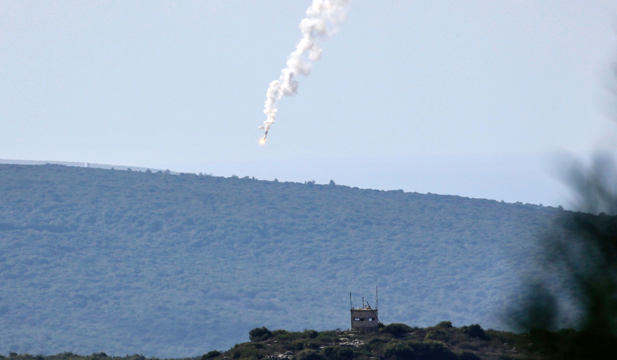 A flare is fired by Israeli troops over a forested area near Alma Al-Shaab in southern Lebanon near the border with Israel on December 6, 2023. (AFP)