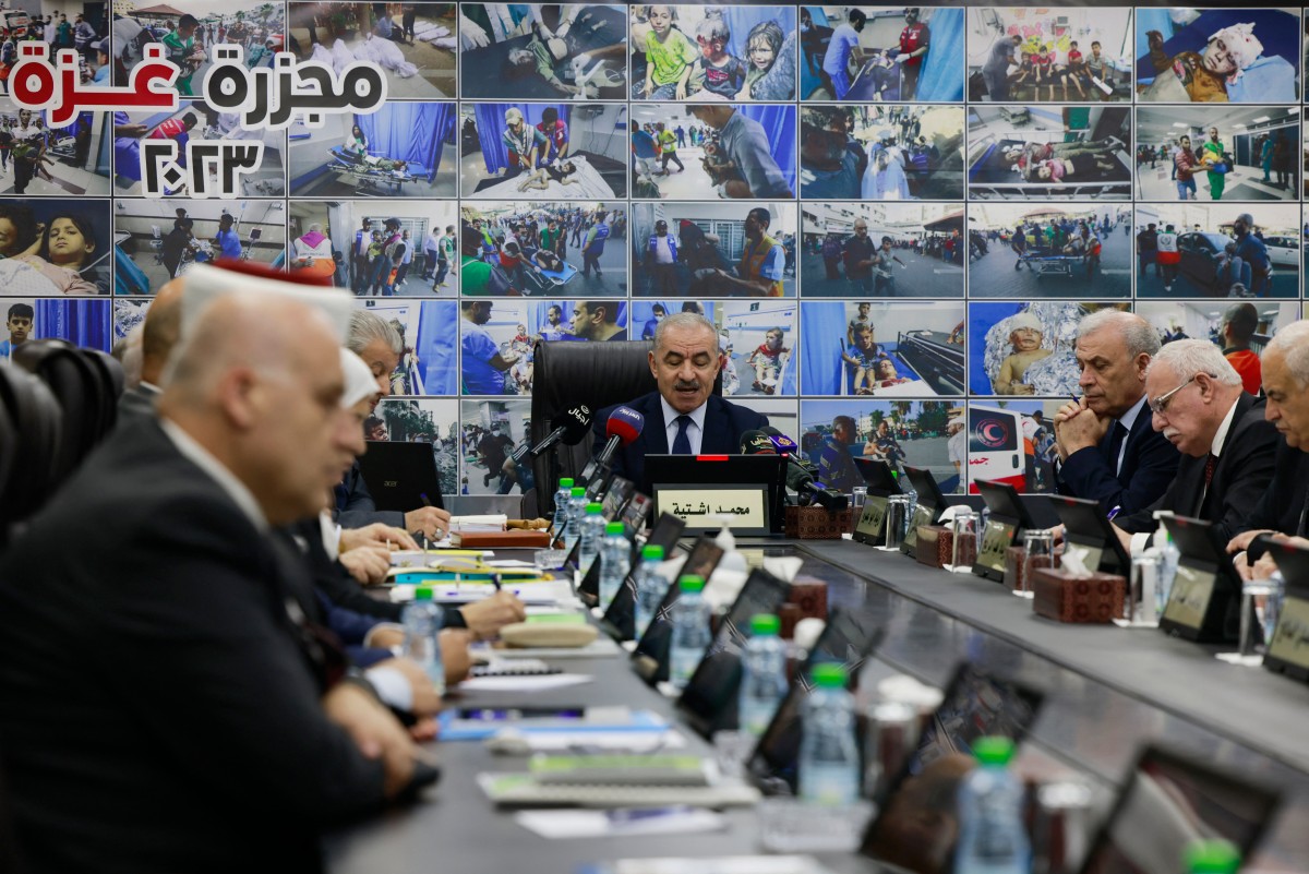 Palestinian prime minister Mohammad Shtayyeh speaks during a cabinet meeting in the West Bank city of Ramallah (AFP)