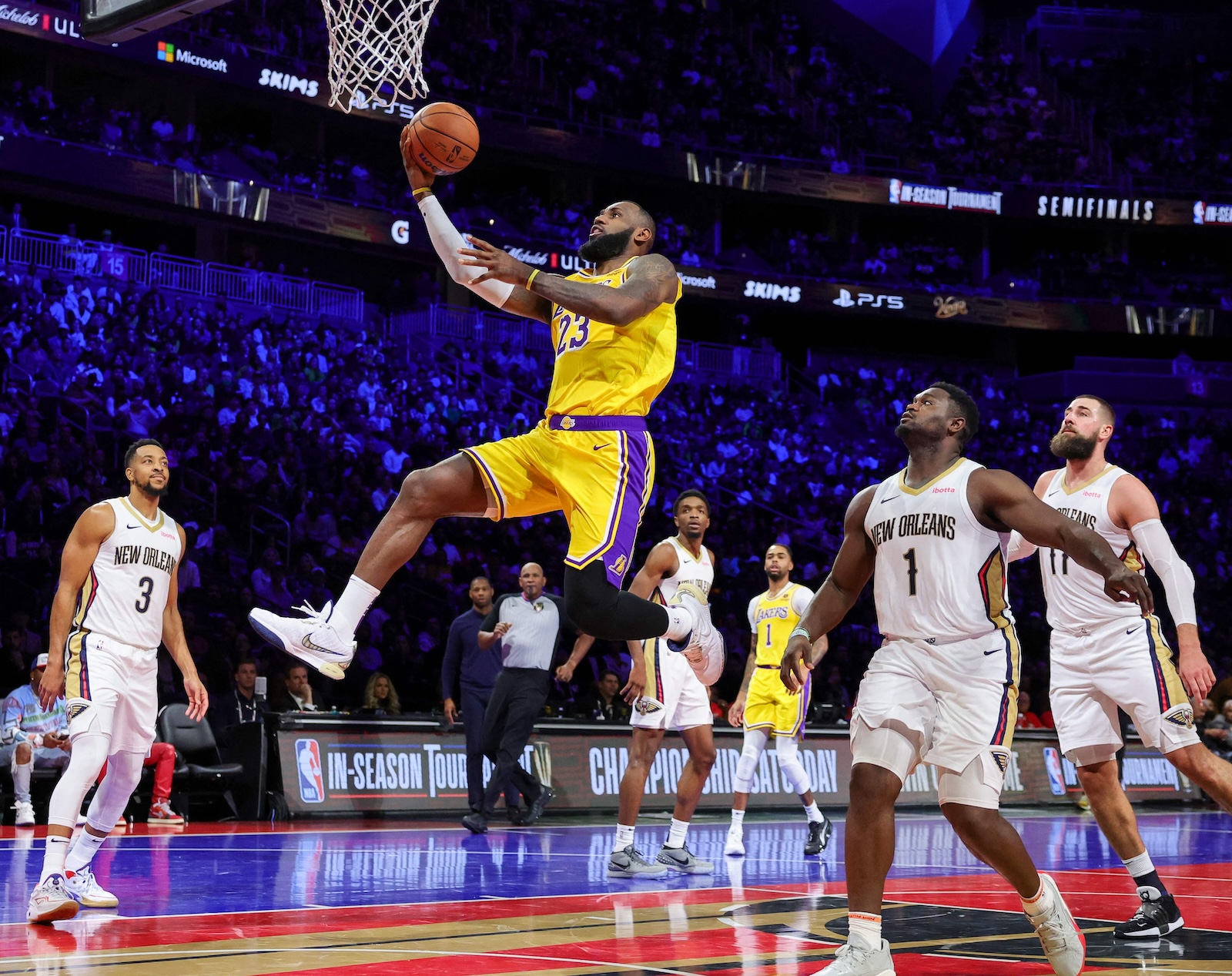 LeBron James of the Los Angeles Lakers drives in for a layup against the New Orleans Pelicans in the first half of the West semifinal game of the inaugural NBA In-Season Tournament at T-Mobile Arena (AFP)