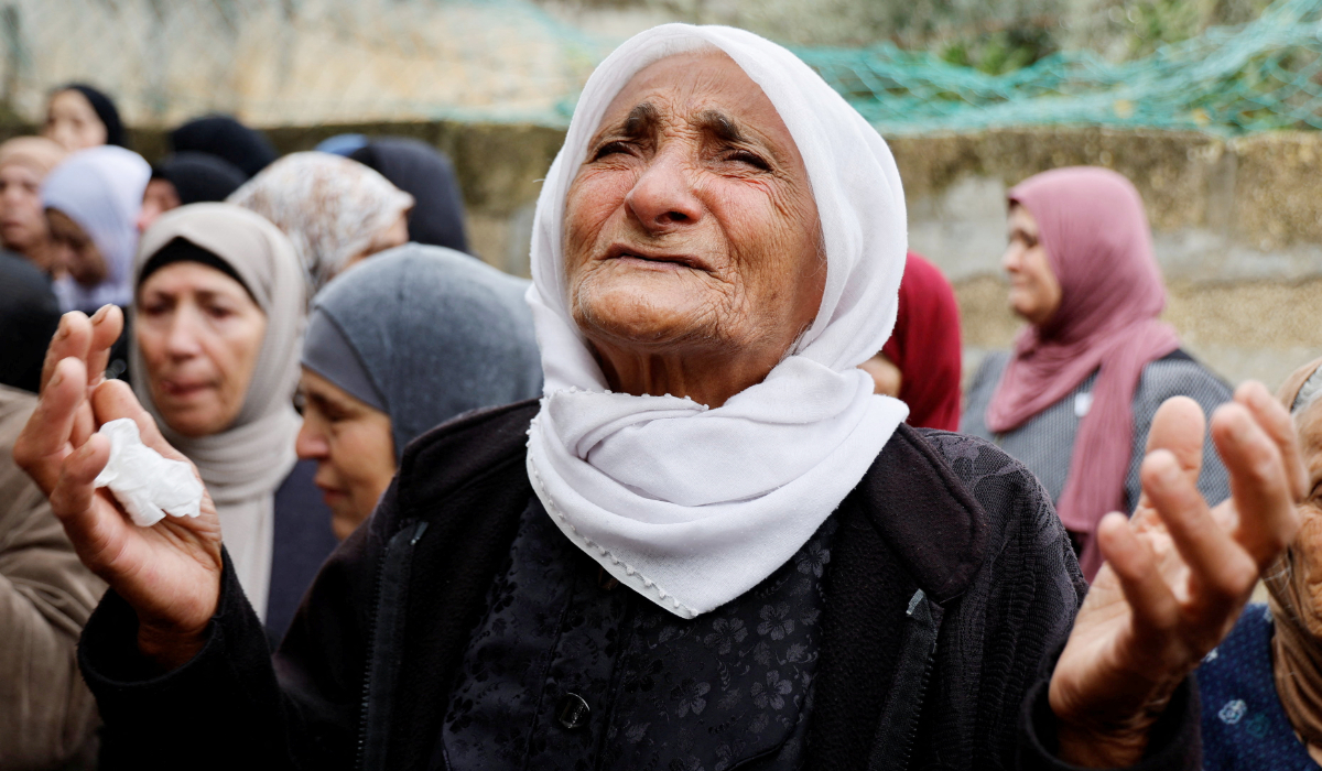 A woman reacts during the funeral of Omar Abu Baker, 16, in the West Bank. The boy was killed in an Israeli raid, near Jenin. (Reuters)