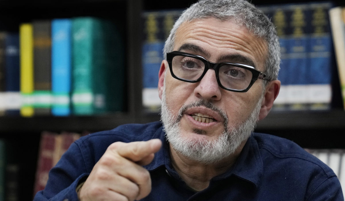 Doctor Ghassan Abu Sitta, a Palestinian-British plastic surgeon specializing in conflict medicine, speaks during an interview with The Associated Press at the Institute for Palestine Studies in Beirut, Lebanon, Saturday, Dec. 9, 2023. (AP)
