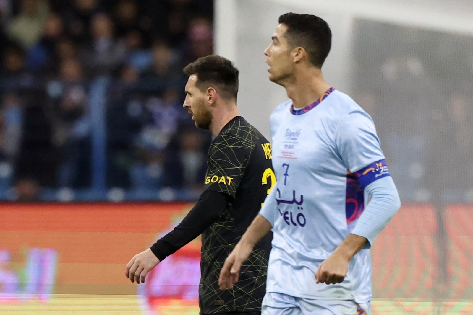 Paris Saint-Germain's Argentine forward Lionel Messi (L) and Riyadh All-Star's Portuguese forward Cristiano Ronaldo during the Riyadh Season Cup football match between the Riyadh All-Stars and Paris Saint-Germain at the King Fahd Stadium in Riyadh on Jan. 19, 2023. (File/AFP)
