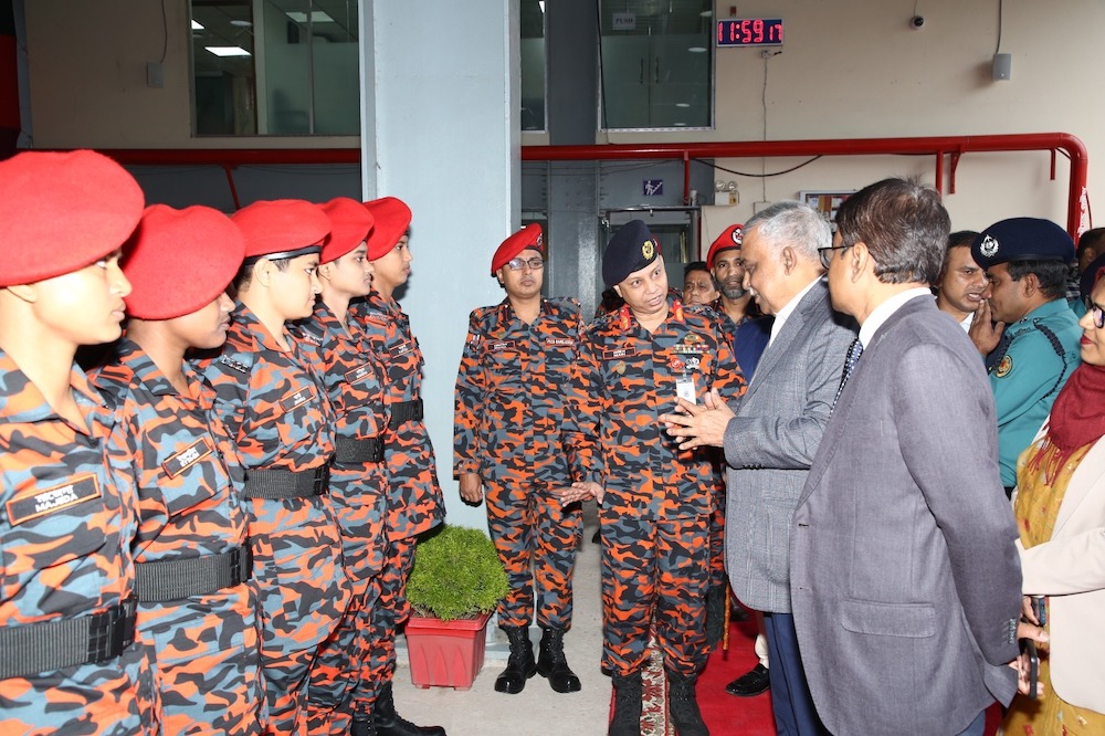 Bangladeshi Home Minister Asaduzzaman Khan Kamal, right, visits Bangladesh’s first batch of female firefighters at a training center in Maripur near Dhaka on Dec. 7, 2023. (Fire Service and Civil Defense Directorate)