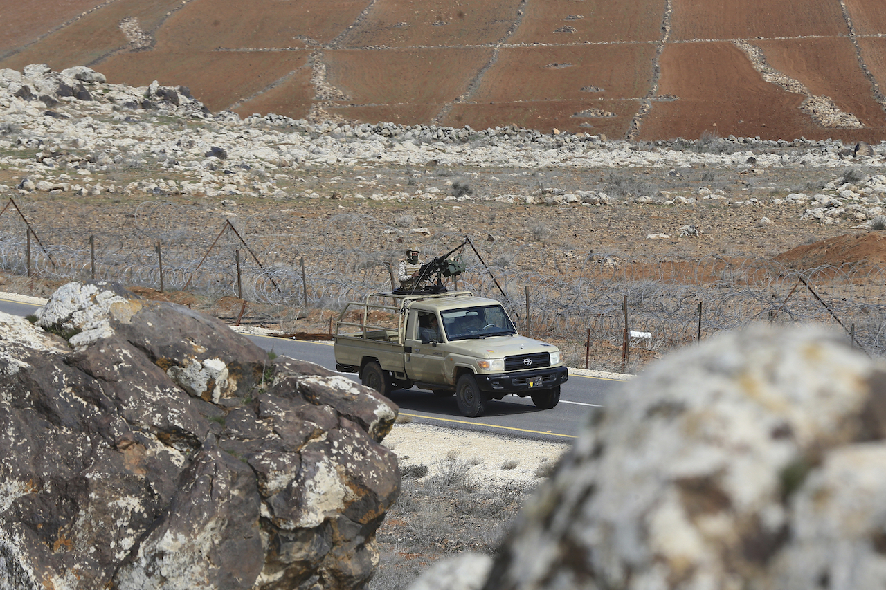 Jordanian soldiers patrol along the eastern Jordan-Syria border, in al-Washash, Mafraq governorate, Jordan, Thursday, Feb. 17, 2022. (AP)