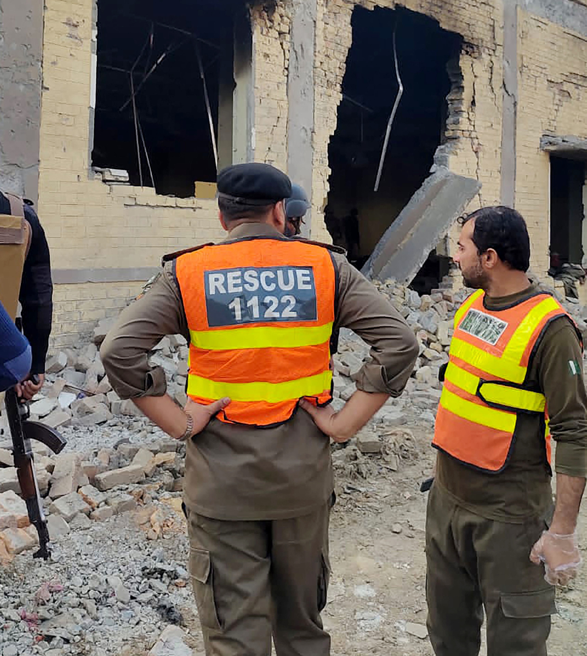 Rescuers stand at the site of a militant attack in the town of Daraban, Dera Ismail Khan district, in Khyber Pakhtunkhwa, on Tuesday. (AFP)
