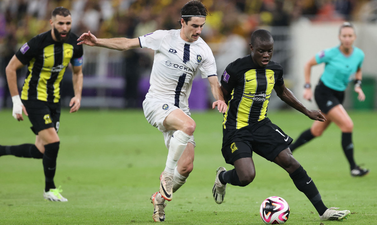 Ittihad's French midfielder #07 N'Golo Kante (R) fights for the ball near Ittihad's French forward #09 Karim Benzema (L) during the FIFA Club World Cup first round football match between Al-Ittihad and Auckland City at the King Abdullah Sports City stadium in Jeddah, on December 12, 2023. (AFP)