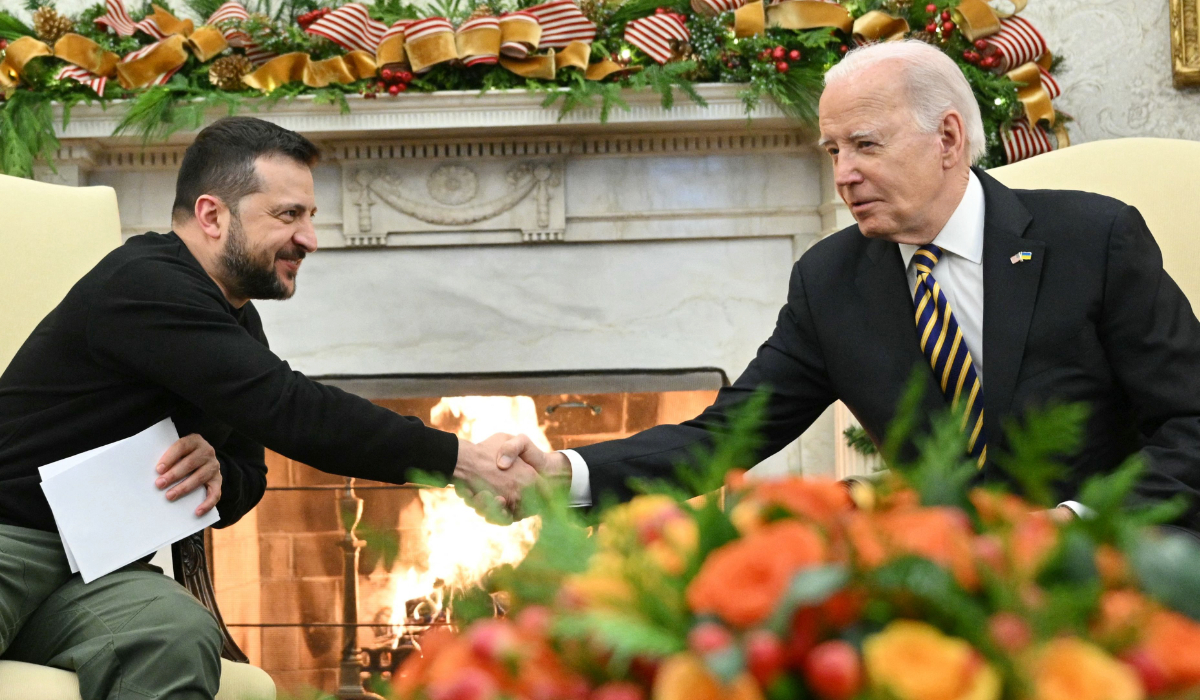 US President Joe Biden shakes hands with Ukrainian President Volodymyr Zelensky as they meet in the Oval Office of the White House in Washington, DC, on December 12, 2023. (AFP)