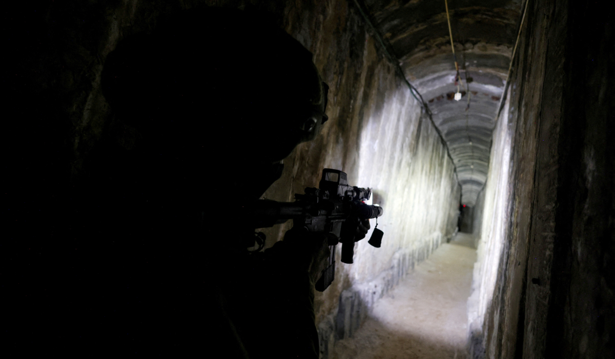 An Israeli soldier secures a tunnel underneath Al Shifa Hospital in Gaza City, amid the ongoing ground operation of the Israeli army against Palestinian Islamist group Hamas, in the northern Gaza Strip, November 22, 2023. (REUTERS)