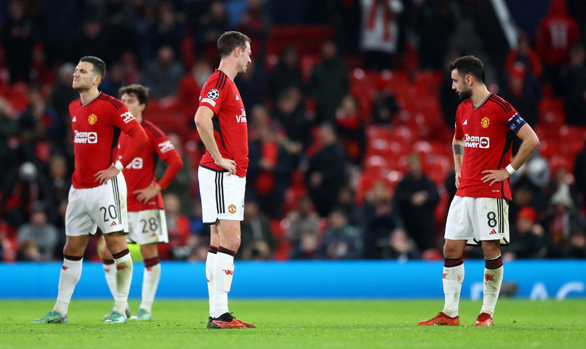 Manchester United's Jonny Evans and Bruno Fernandes look dejected after the match against Bayern Munich in UEFA Champions League group A football match at Old Trafford stadium in Manchester. (Reuters)