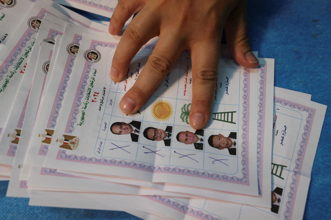 Election officials count ballots inside a school used as a polling station and a counting centre, during the presidential election in Cairo, Egypt, December 12, 2023. (Reuters)
