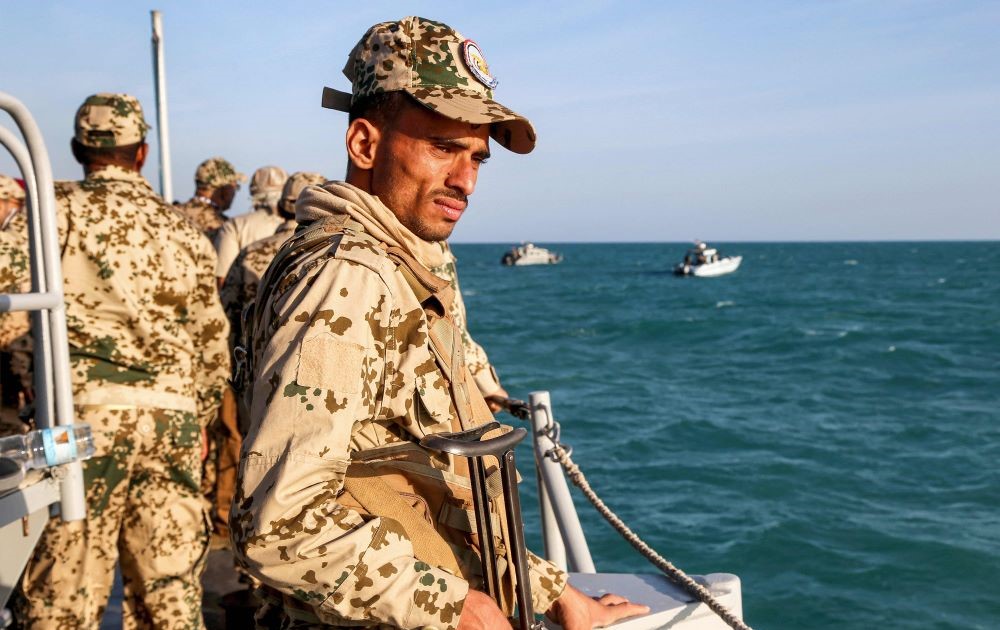 A member of the Yemeni coast guard on a patrol boat in the Red Sea, off Mokha, Taiz province, close to the strategic Bab El-Mandab Strait, Dec. 12, 2023. (AFP)