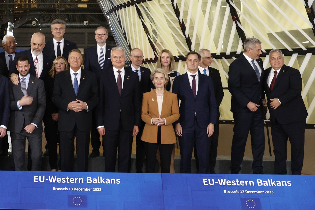 Hungary's Prime Minister Viktor Orban, right, speaks with Austria's Chancellor Karl Nehammer, second right, during a group photo of European Union and Western Balkan leaders at an EU-Western Balkans summit in Brussels on Dec. 13, 2023. (AP Photo)