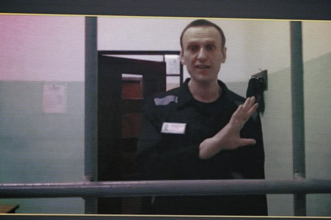 Russian opposition leader Alexei Navalny, seen on a TV screen as he appears in a video link provided by the Russian Federal Penitentiary Service from the colony in Melekhovo, Vladimir region, during a hearing at the Russian Supreme Court in Moscow in August 2023. (AP/File)