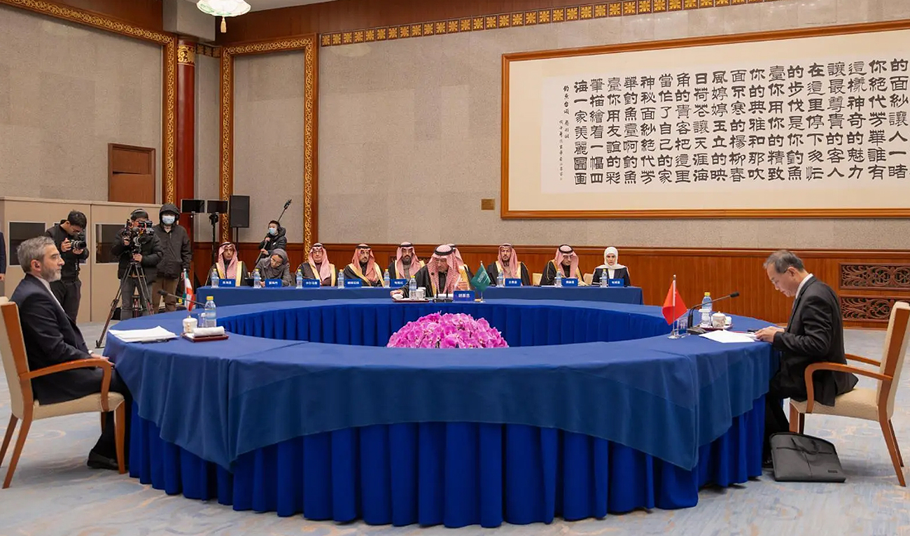 In this handout photo, taken and released by Saudi Press Agency, China Deputy Foreign Minister Deng Li (right) holds a group meeting with Saudi Arabia’s Deputy Minister of Foreign Affairs Eng. Walid bin Abdulkarim Al-Khuraiji (center) and his Iranian counterpart, Dr. Ali Bagheri Kani (left), to follow up on the Beijing Agreement in Beijing on December 15, 2023. (Photo courtesy: SPA)