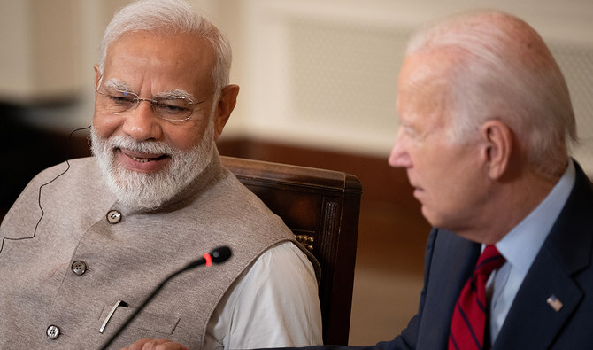 India's Prime Minister Narendra Modi and US President Joe Biden embrace hands during a meeting with senior officials and CEOs of American and Indian companies, in the East Room the White House in Washington, DC, on June 23, 2023. (AFP/File)