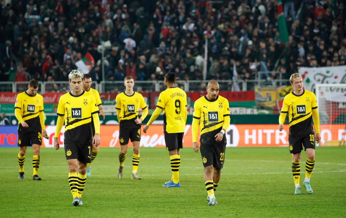 Dortmund’s players react after their Bundesliga match against Augsburg in Augsburg on Dec. 16, 2023. (AFP)