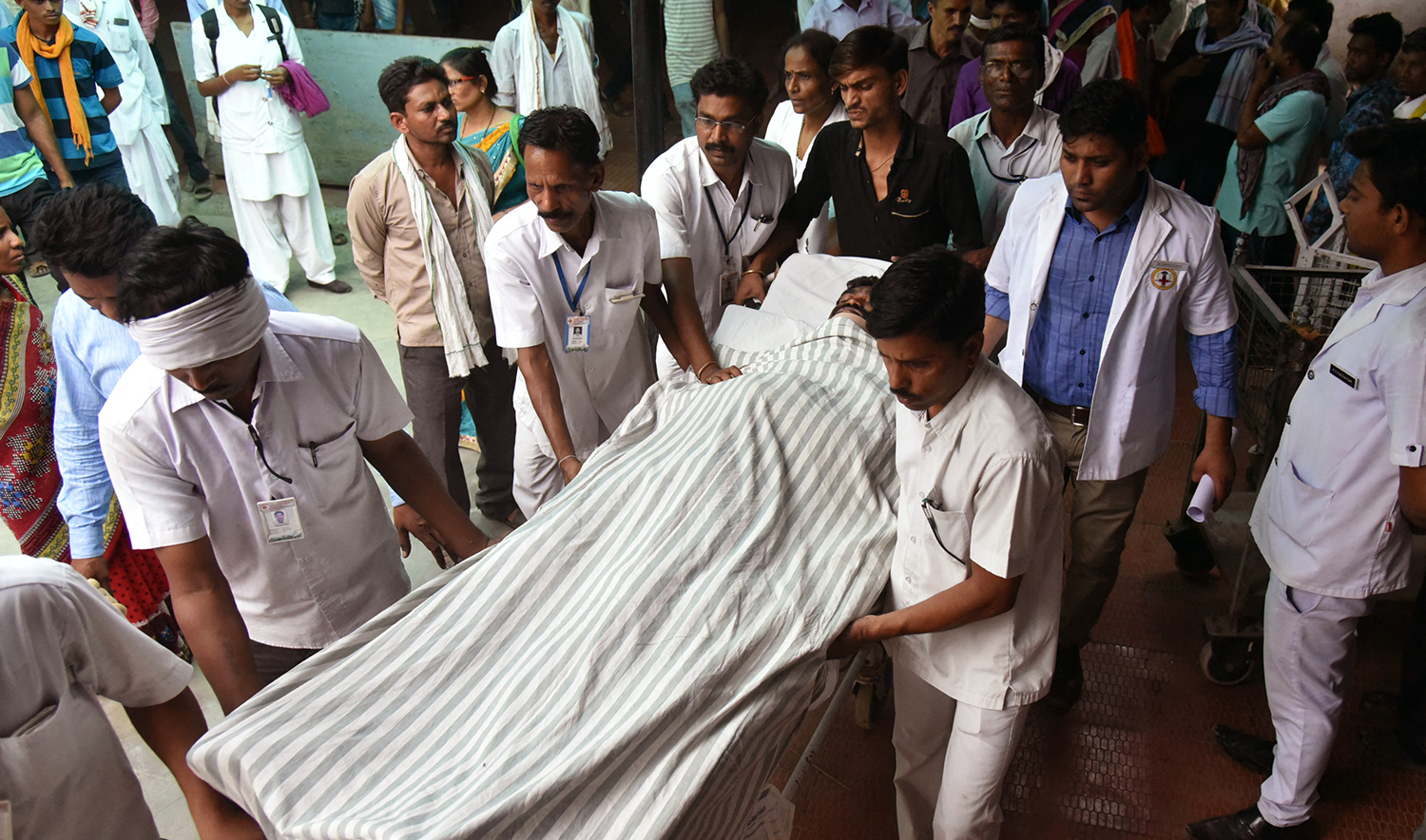 This representational file photo shows Indian medical staff bringing a man injured in a fire to hospital in Wardha some 100kms from Nagpur, Pakistan on May 31, 2016. (AFP)