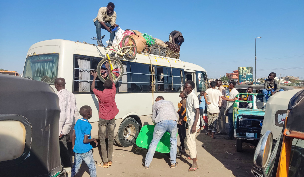 Displaced people fleeing from Wad Madani in Sudan's Jazira state arrive in Gedaref in the country's east on December 17, 2023. (AFP)